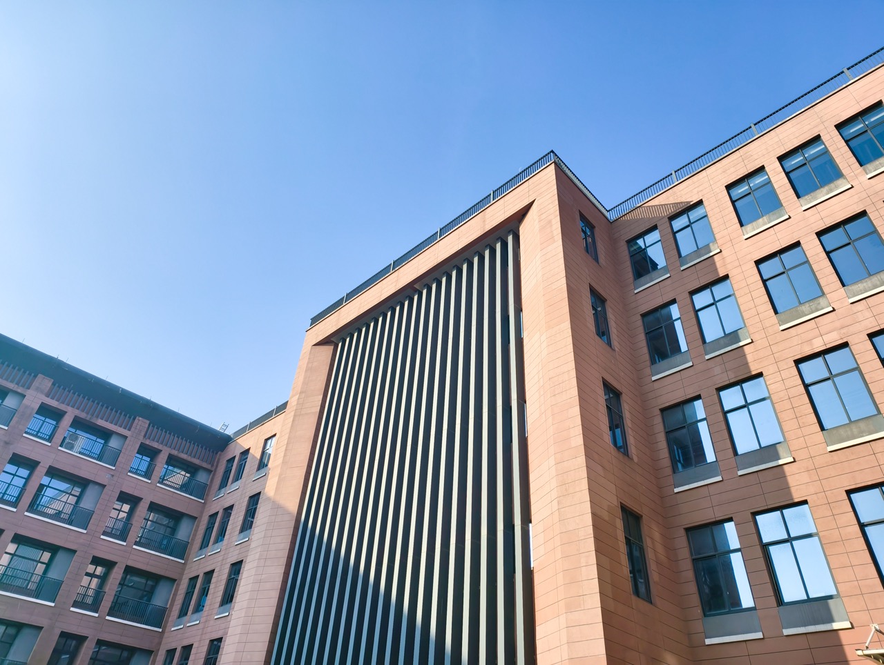 Exterior of modern residential building real estate against blue sky