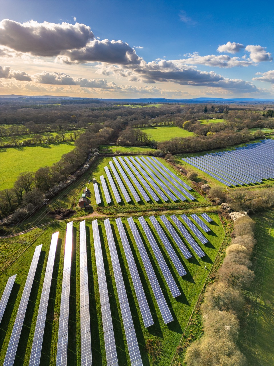 Solar panel cells in a row at a solar farm in the British countryside.